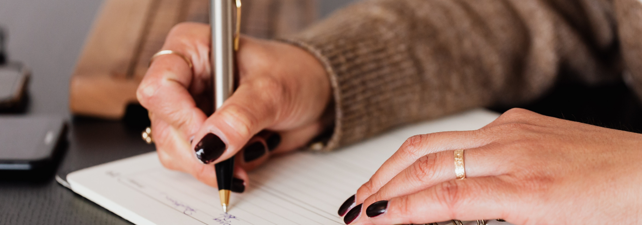 Woman writing in her planner